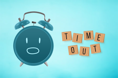TIME OUT text on wooden cubes with shocked face alarm clock on blue background. Business conceptの写真素材
