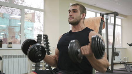 Male bodybuilder training hands. Preparing for the competition. Healthy lifestyleの写真素材