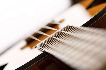 Small Hawaiian four stringed ukulele guitar body closeup. Musical instruments shop or learning...