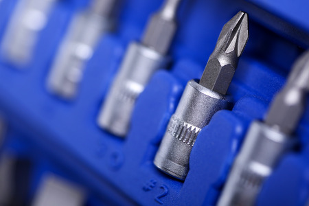 Set of tools closeup (cruciform wrench heads in blue plastic case). Car repair kit, professional instrument shop or store conceptの写真素材