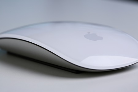 Minsk, Belarus, November 30, 2018 Apple mouse closeup at white table at unusual angleのeditorial素材