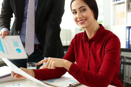 Group of people hold in arms financial papers solve and discuss problem portrait. Fresh view review situation new angle look professional training white collar investment and finance conceptの写真素材