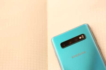 Minsk, Belarus - April 18, 2019: Samsung Galaxy s10 lying at opened note pad page as alternative conceptのeditorial素材