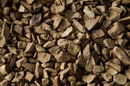 Pile of instant coffee grains making background close-up