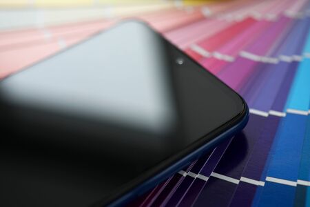 Screen of modern smartphone lying at colorful fantail close-upの写真素材
