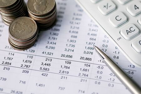 Close-up of increase and decrease budget. Document report with detailed accounting of expenses....
