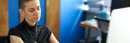 Portrait of busy concentrated woman typing on keyboard. Smart businesswoman sitting in office....