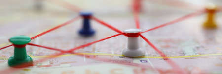 Close-up of map marked with red thread paths of movement. Plan of street with buttons forming route....