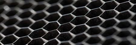 Close-up of metallic hexagon shapes macro shot. Seamless pattern. Geometric background endless...