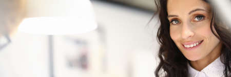 Portrait of happy businesswoman spending time in beauty saloon. Smiling female person looking at camera with happiness and calmness. Beauty salon and chiropody conceptの写真素材