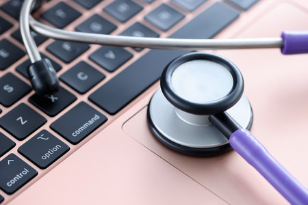 Stethoscope on laptop keyboard. Medical continuing education courses conceptの写真素材