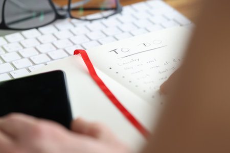 On table is diary with to-do list. Planning and daily routine conceptの写真素材