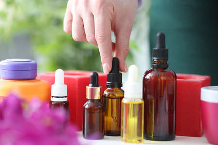 There are aromatic oils for massage on table. Essential oils conceptの写真素材