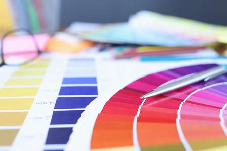 Color palette with different colors is on table. Selection of color ...