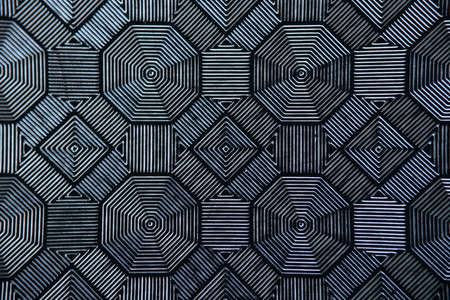 Black patterned tiles in form of rhombuses. Floor and wall designs concept