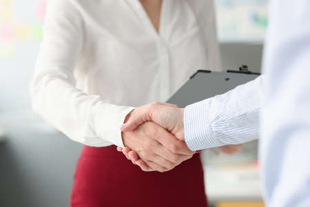 Business people shake hands in handshake closeupの写真素材