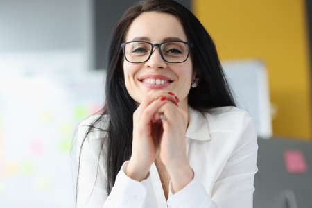 Portrait of a smiling businesswoman wearing glassesの写真素材