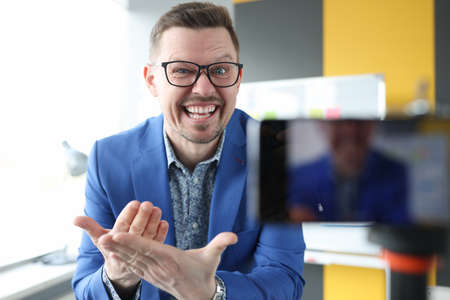 Emotional man teaches online acting courses closeupの写真素材