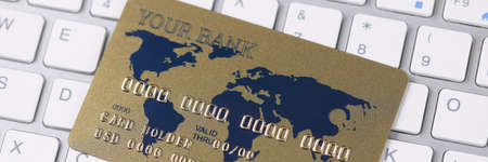 Plastic credit bank card is on keyboardの写真素材