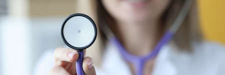 Closeup of phonendoscope in hands of doctor in clinic