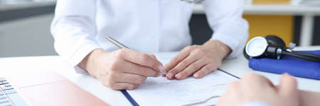 Patient at doctors appointment in medical officeの写真素材