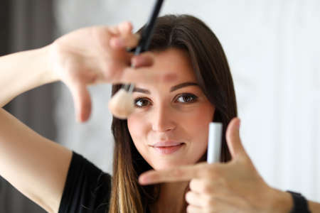 Woman make-up artist offers makeup for photo shoot