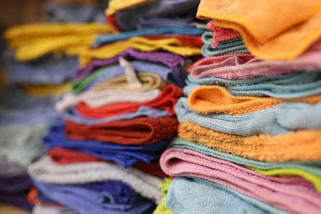 Lots of colorful microfiber cloths on shelf in service centerの写真素材