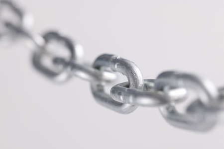 Chromed metal chain links in air closeupの写真素材
