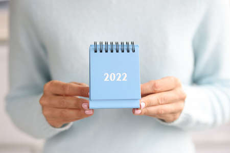 Blue desk calendar for 2022. Planning business tasks for next yearの写真素材