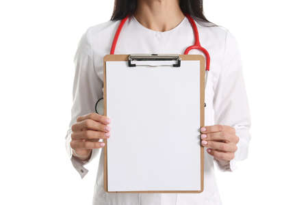Doctor holding white blank clipboard on white backgroundの写真素材