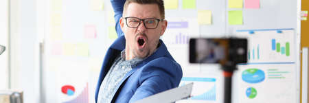 Emotionally motivated male coach conducts online business trainingの写真素材