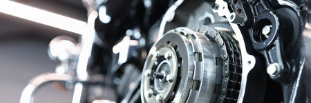 Sports motorcycle engine in service center closeup