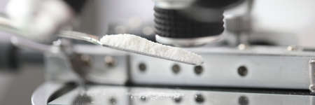 Study of white powder in a laboratory under microscope closeupの写真素材
