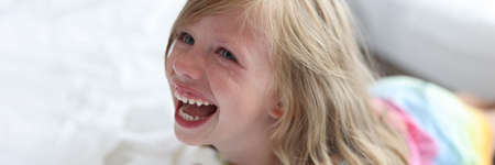 Portrait of crying screaming little girl closeup