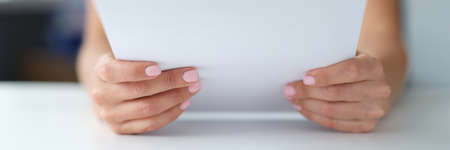 Woman reading notice of mortgage payments closeupの写真素材