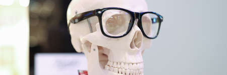 Mock up of human skeleton with glasses closeup