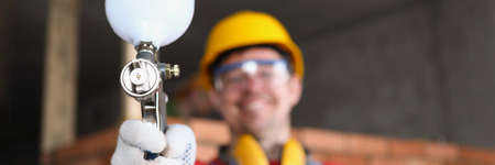 Repairman and red brick wallの写真素材