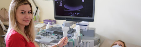 Woman doctor conducts medical diagnostics on ultrasoundの写真素材