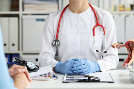 Gynecologist doctor conducts medical consultation of patient in clinicの写真素材