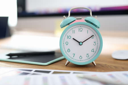 Alarm clock for ten oclock at workplace in officeの写真素材
