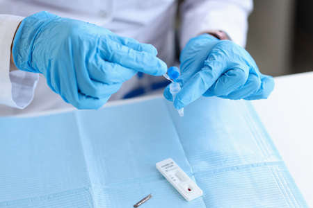 Express covid-19 test by doctor in laboratoryの写真素材