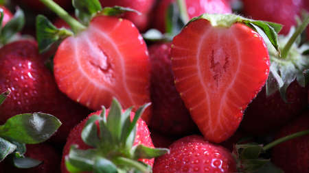 Delicious ripe sweet sliced strawberry closeup. Useful berries