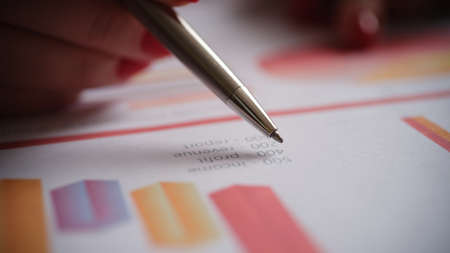 Financial business woman analyze company work schedule for profit and growthの写真素材