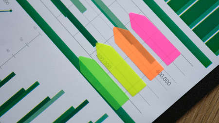 Colored sticker stripes on business analytics chart closeupの写真素材