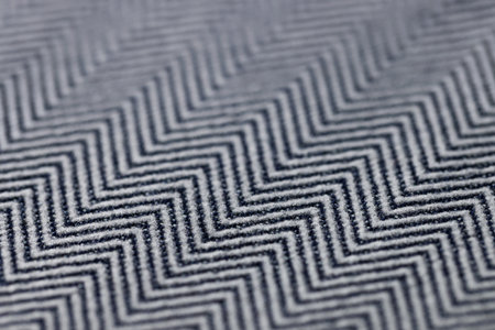 Black and grey herringbone fabric texture backgroundの写真素材