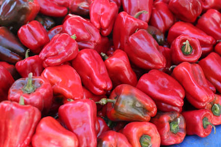 Juicy ripe red sweet peppers on market