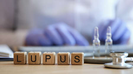 Word lupus collected of wooden cubes in rawの写真素材