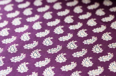 Dark smooth fabric with feather print seamless pattern backdropの写真素材