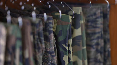 Collection of military uniform trousers in wardrobeの写真素材