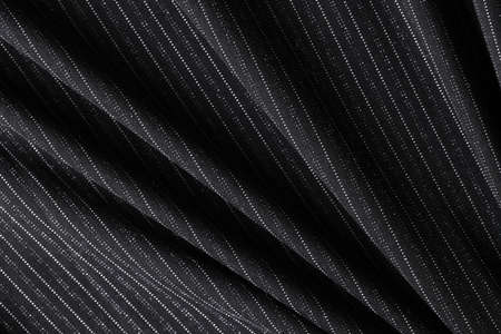 Black striped fabric textured background for design art work